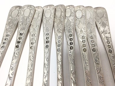 Lot 289 - Set of nine George III silver fruit forks, with engraved foliate decoration