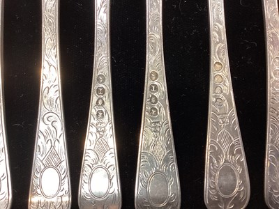 Lot 289 - Set of nine George III silver fruit forks, with engraved foliate decoration