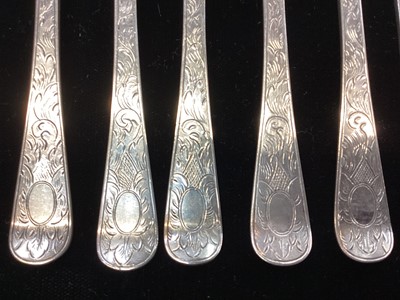 Lot 289 - Set of nine George III silver fruit forks, with engraved foliate decoration