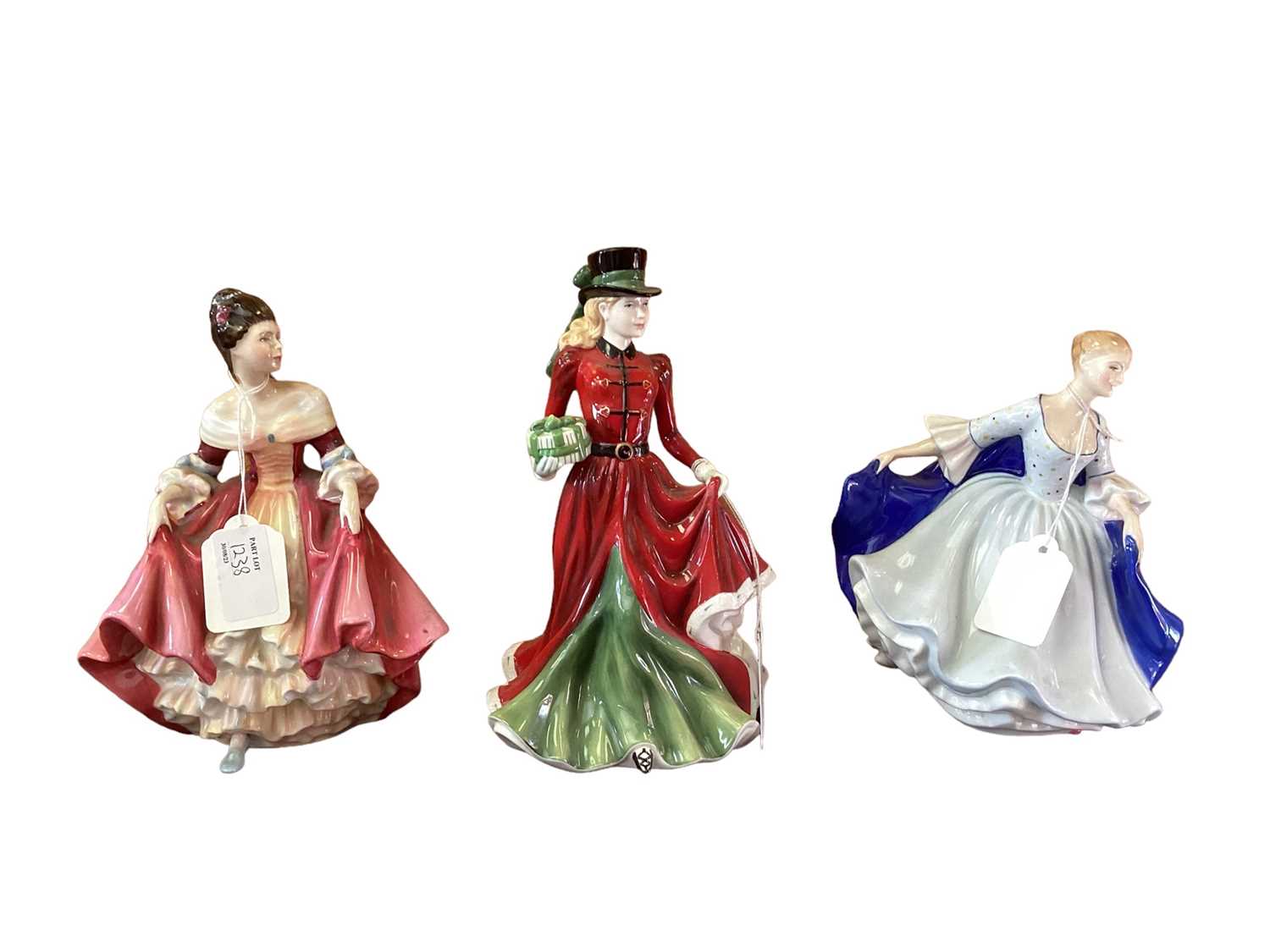 Lot 1238 - Ten Royal Doulton figures - Christmas Day 2006 HN4899, Southern Belle HN2229, Ann HN3259, La Sylphide HN2138, Chloe HN3883, Dulcie HN2305, Coralie HN2307, Helen HN3601, Tender Moment HN3303 and Ali...