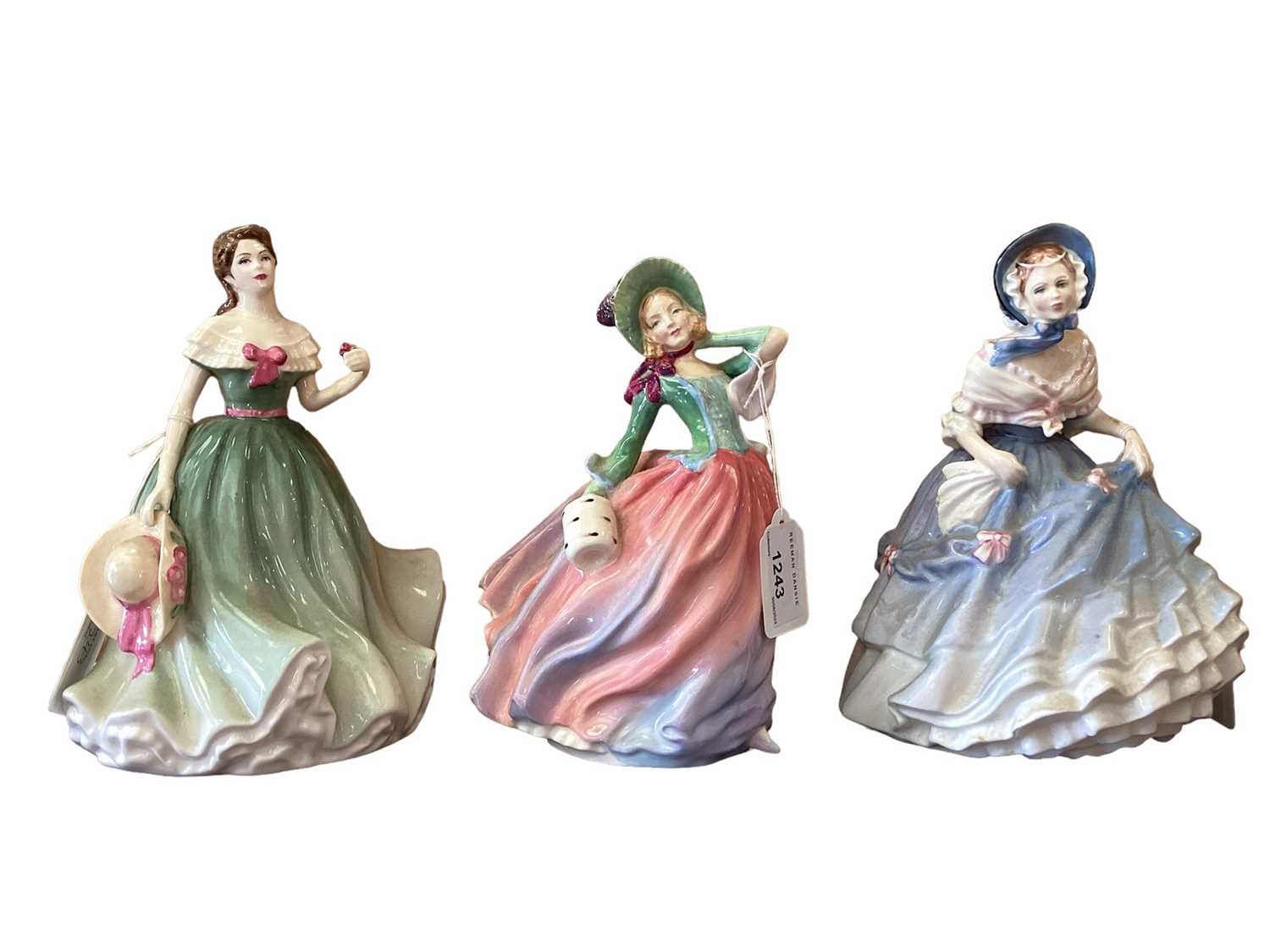 Lot 1243 - Ten Royal Doulton figures - Autumn Breezes HN1911, Masque HN2554, Alice HN4787, Adrienne HN2304, Winter's Day HN3769, Alice HN3368, My Love HN2339, Helen HN4806, Geraldine HN2348 and Caroline HN317...