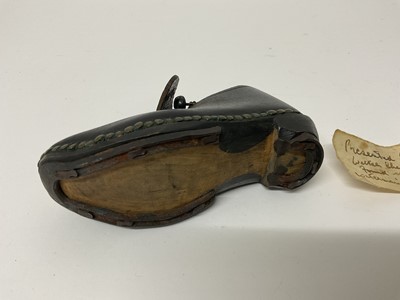 Lot 63 - Mysterious leather child's clog with note of provenance ''Presented by Walter Sheldrake, found when digging a water main at Ealing 1955''