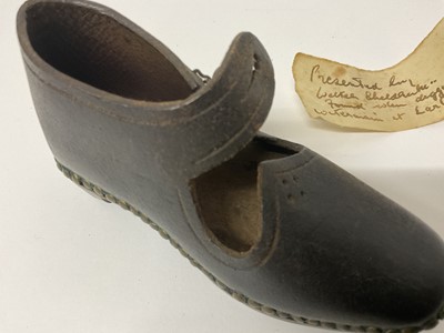 Lot 63 - Mysterious leather child's clog with note of provenance ''Presented by Walter Sheldrake, found when digging a water main at Ealing 1955''