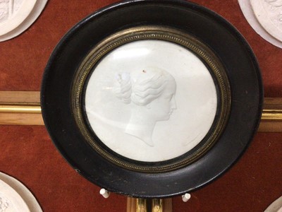 Lot 980 - Victorian parian ware relief plaque together with a set of four plaster roundels