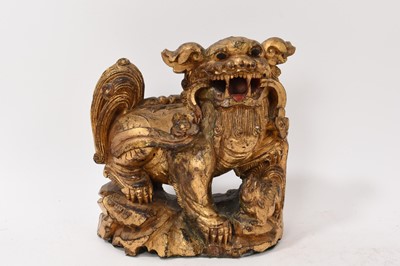 Lot 874 - Antique Chinese carved gilt Buddhist lion and pair of carved guardians