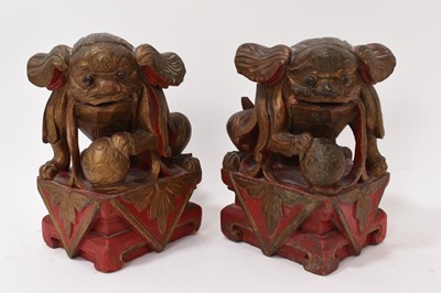 Lot 874 - Antique Chinese carved gilt Buddhist lion and pair of carved guardians
