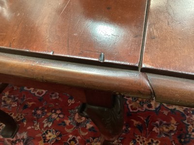 Lot 1307 - George II Cuban mahogany drop-leaf dining table