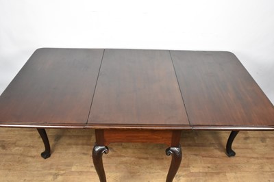 Lot 1307 - George II Cuban mahogany drop-leaf dining table