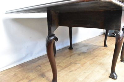 Lot 1307 - George II Cuban mahogany drop-leaf dining table