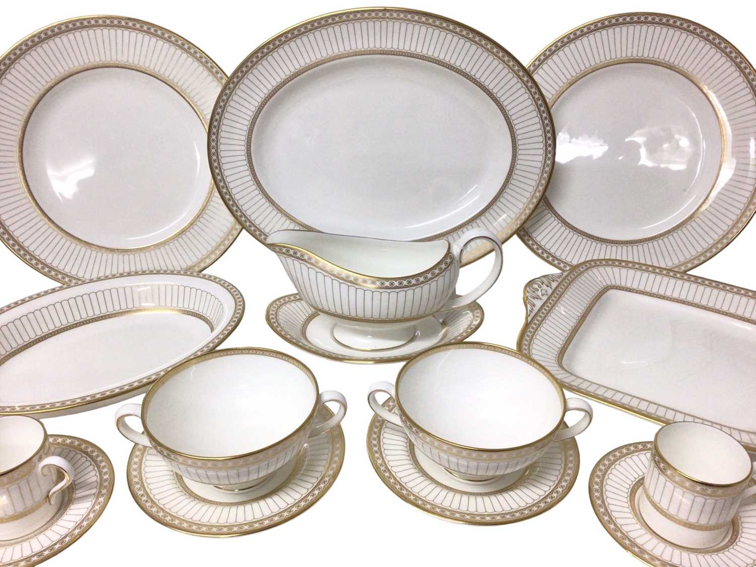 Lot 204 - Wedgwood Colonnade pattern six-eight place service for dinner and coffee, W4339 with gilded decoration, approximately 70 pieces.