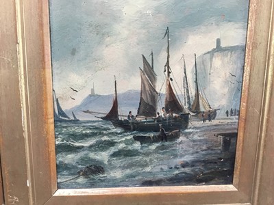 Lot 95 - English School 19th century, oils on board, fishing vessel beached by cliffs, and a sailing barge at anchor, a pair of in gilt frames, initialled J.B. Each 19 x 14cm. (2)