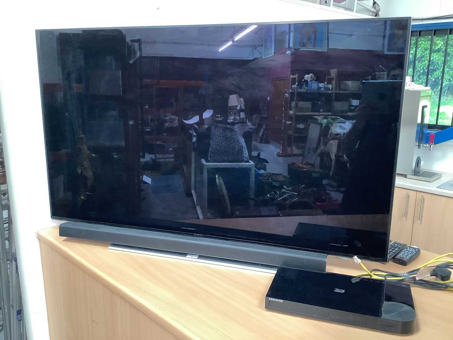 Lot 1 - 54" Samsung UHD flat screen TV - Samsung DVD/Blue ray player, Samsung sound bar with remote speaker (Complete with remote controls, leads and instruction's together with 100 Gb external hard drive)