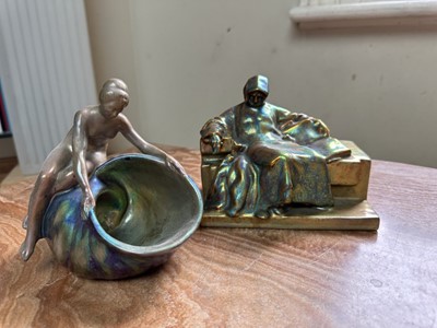 Lot 1507 - Early 20th century Zsolnay iridescent figure of Anonymous, and another. girl with shell