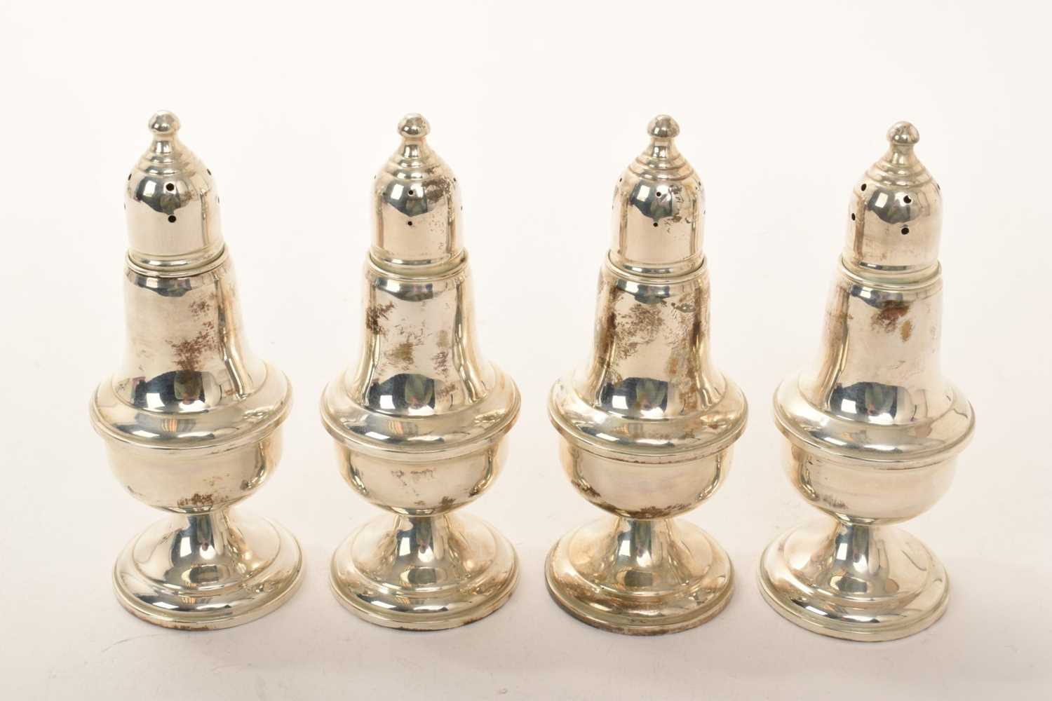 Lot 16 - Set of four contemporary American Sterling silver casters of baluster form