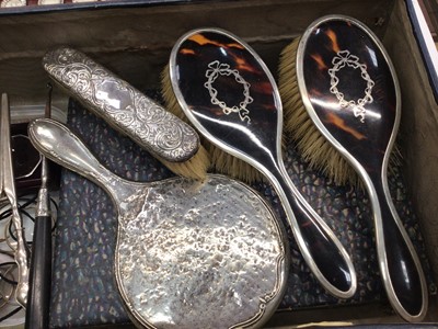 Lot 34 - Group of silver mounted dressing table mirrors and brushes including enamelled and tortoiseshell, pair of silver handled glove stretchers, other items, cased manicure set and a collection of eye...