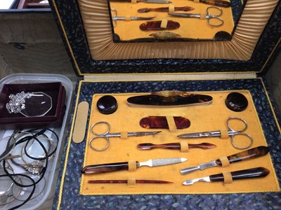 Lot 34 - Group of silver mounted dressing table mirrors and brushes including enamelled and tortoiseshell, pair of silver handled glove stretchers, other items, cased manicure set and a collection of eye...