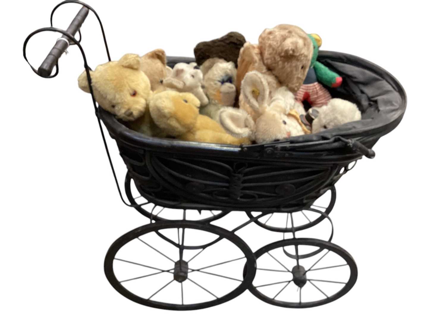 Lot 2644 - Steiff bunny and other bears housed in a vintage pram