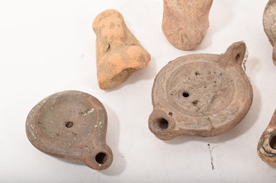 Lot 877 - Ancient pottery votive figure, 11cm high and a fragmentary figure
