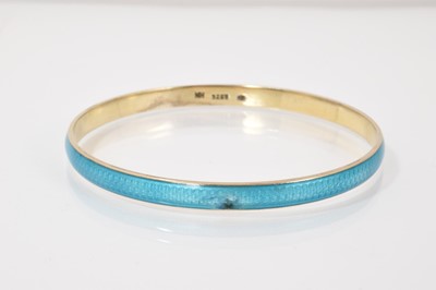 Lot 62 - Four silver/white metal brooches all with enamel decoration, silver and blue enamel bangle and an Art Nouveau style white metal and enamel panel bracelet (6 items)