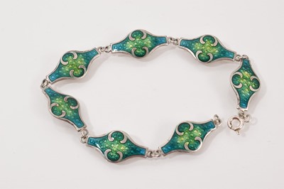 Lot 62 - Four silver/white metal brooches all with enamel decoration, silver and blue enamel bangle and an Art Nouveau style white metal and enamel panel bracelet (6 items)