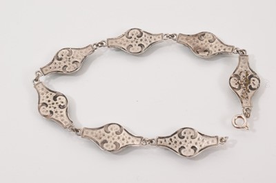 Lot 62 - Four silver/white metal brooches all with enamel decoration, silver and blue enamel bangle and an Art Nouveau style white metal and enamel panel bracelet (6 items)