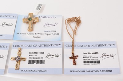 Lot 12 - Fifteen 9ct gold gem set cross pendants, one on 9ct gold chain and pair of 9ct gold gem set cross earrings, mostly with Gems TV certificates