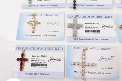 Lot 12 - Fifteen 9ct gold gem set cross pendants, one on 9ct gold chain and pair of 9ct gold gem set cross earrings, mostly with Gems TV certificates