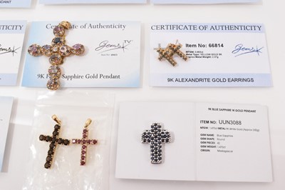 Lot 12 - Fifteen 9ct gold gem set cross pendants, one on 9ct gold chain and pair of 9ct gold gem set cross earrings, mostly with Gems TV certificates