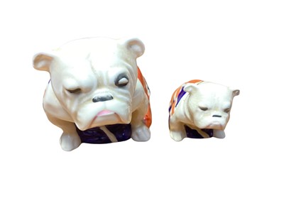 Lot 1106 - Two Royal Doulton bulldogs draped in Union Jack flags