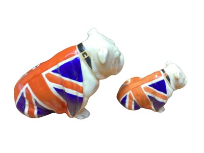 Lot 1106 - Two Royal Doulton bulldogs draped in Union Jack flags
