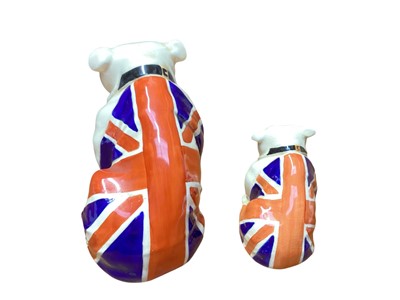 Lot 1106 - Two Royal Doulton bulldogs draped in Union Jack flags