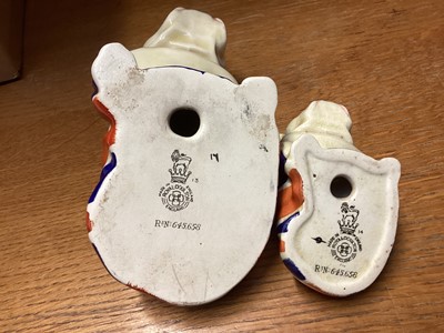 Lot 1106 - Two Royal Doulton bulldogs draped in Union Jack flags