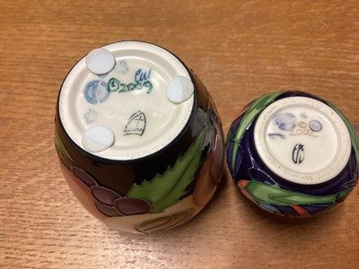 Lot 1149 - Moorcroft pottery vase decorated in the Pomegranate Reborn pattern, dated 2009, together with another decorated in the Celtic Web pattern, dated 2002 (2)