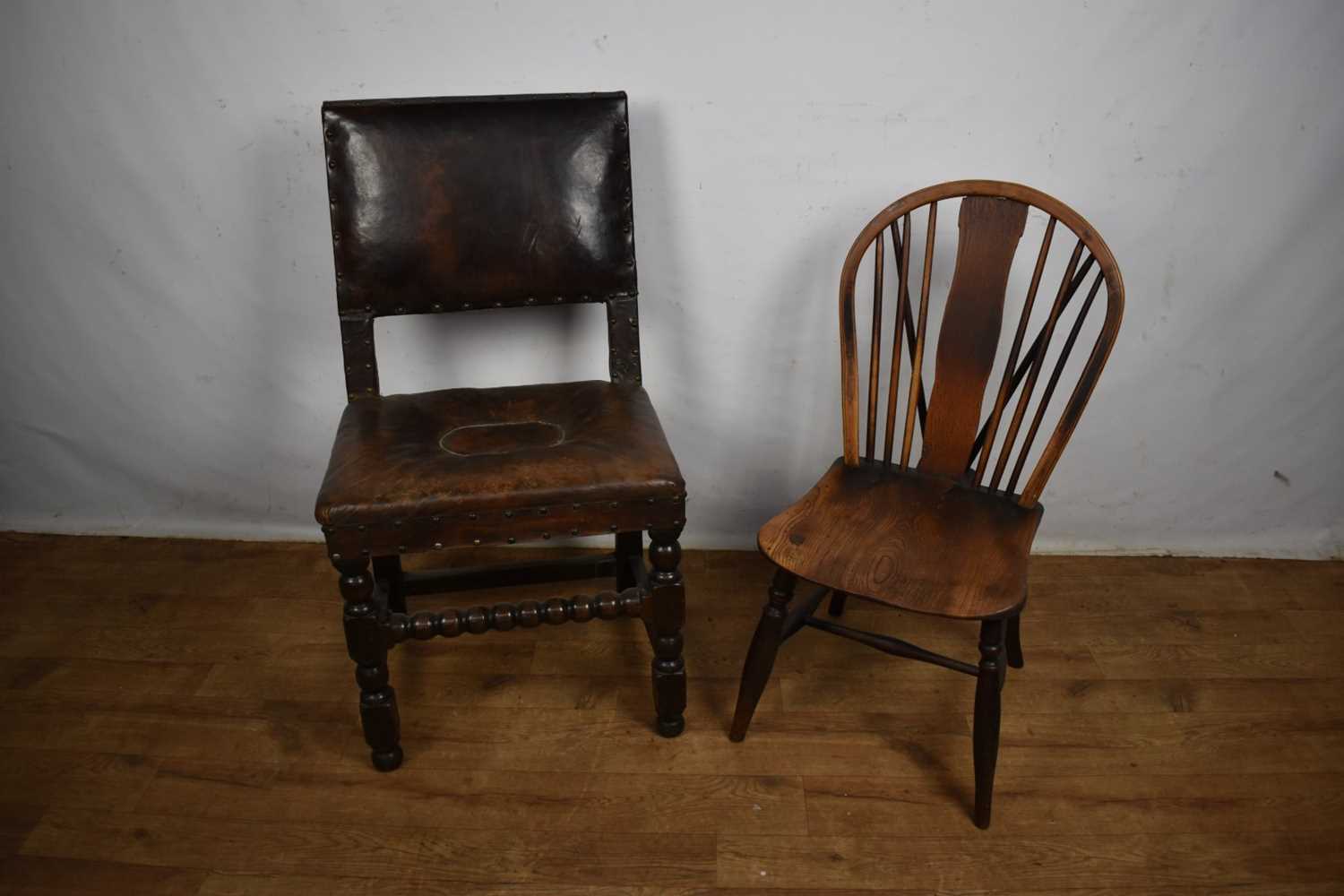 Lot 1536 - Carolean leather upholstered oak side chair, together with an ash and elm Windsor chair