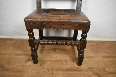 Lot 1536 - Carolean leather upholstered oak side chair, together with an ash and elm Windsor chair