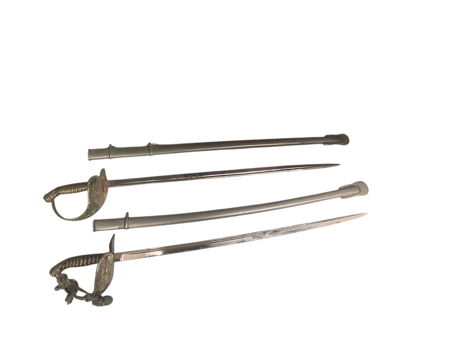 Lot 804 - Two First World War miniature Imperial German letter openers in the form of swords (2).