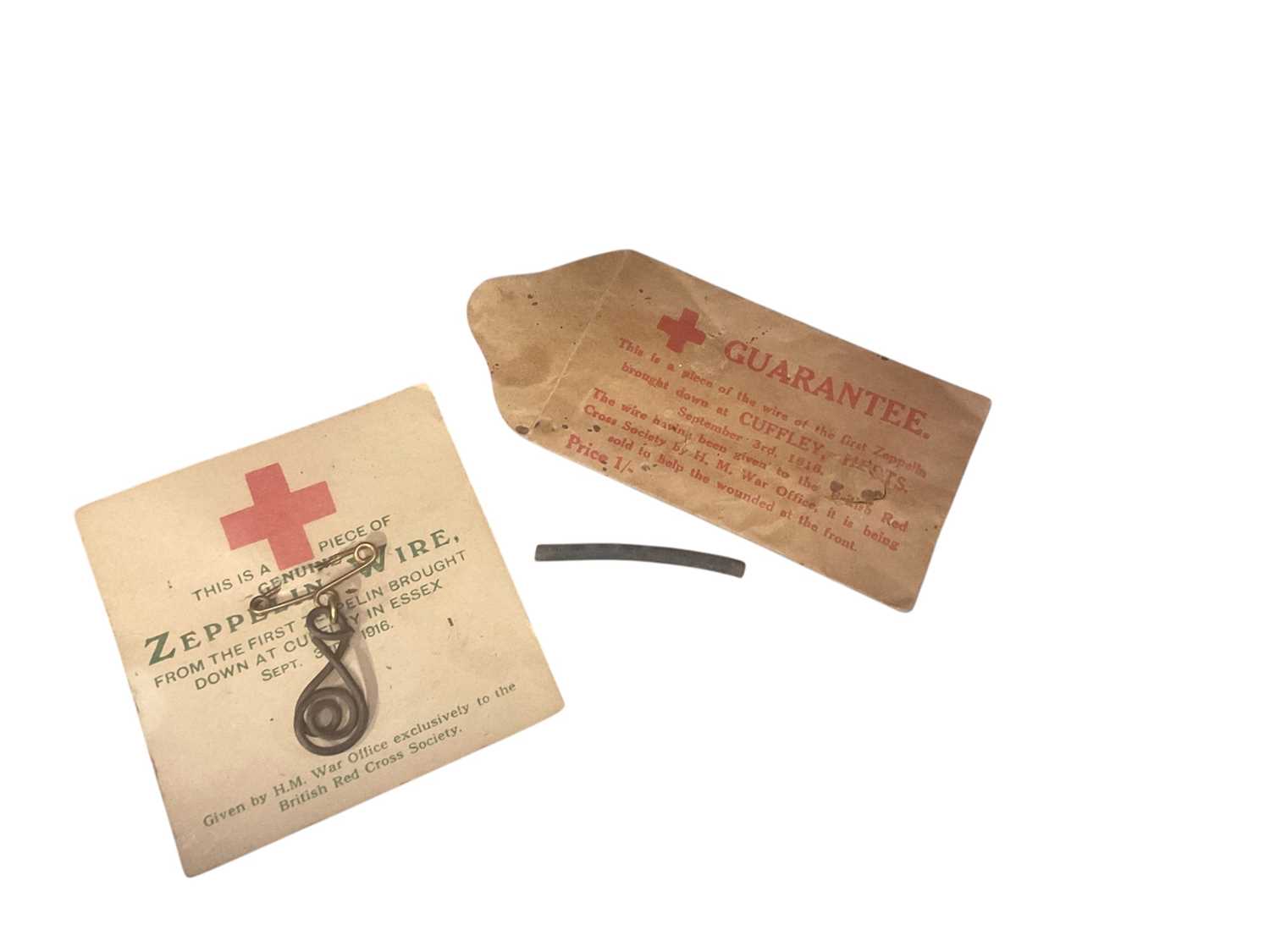 Lot 805 - First World War Zeppelin interest- two fragments of L21 brought down by William Leefe Robinson V.C. on 3rd September 1916, with original envelope and paper backings (2).