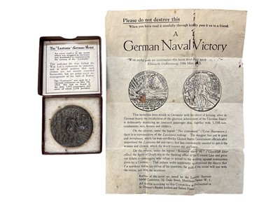 Lot 809 - Group of four medals / medallions to include two R.M.S. Lusitania medals, one boxed, a Jutland medal, and a Verdun medal (4).
