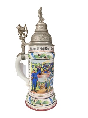 Lot 845 - Imperial German military porcelain stein with hinged pewter lid with soldier with wounded and lion mounts, transfer and painted military decoration named to ' Joh.Schwiewager, Kyle.hay.16.Inft.R...