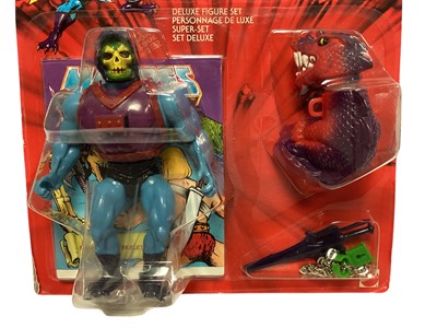 Lot 1704 - Mattel (c1985) Masters of the Universe & maitres de L'Univers dual logo Skeletor 6" action figure with Dragon Backpack, on card (worn to edges) and bubblepack (1)