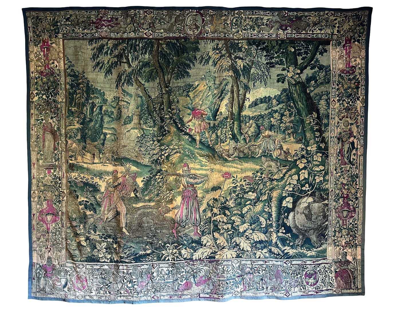 Lot 1722 - A late 16th century Flemish tapestry worked with bear hunting scenes in a mountainous forest