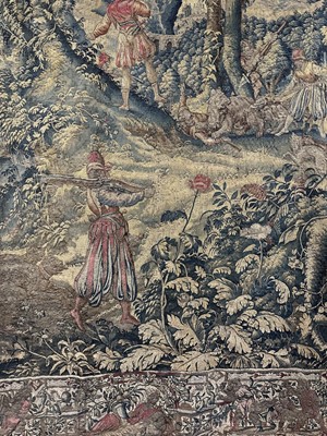 Lot 1722 - A late 16th century Flemish tapestry worked with bear hunting scenes in a mountainous forest