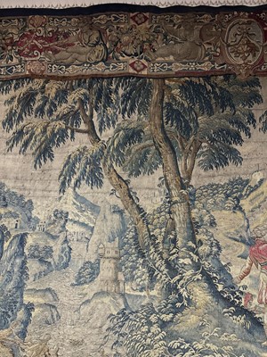 Lot 1722 - A late 16th century Flemish tapestry worked with bear hunting scenes in a mountainous forest