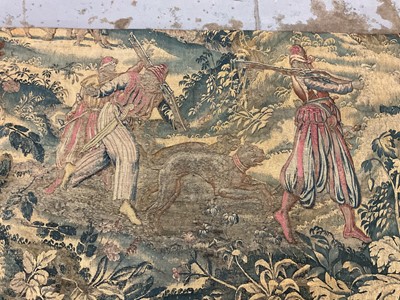 Lot 1722 - A late 16th century Flemish tapestry worked with bear hunting scenes in a mountainous forest