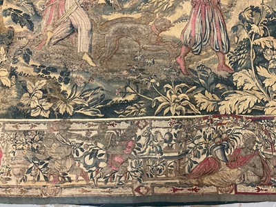 Lot 1722 - A late 16th century Flemish tapestry worked with bear hunting scenes in a mountainous forest