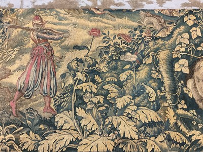 Lot 1722 - A late 16th century Flemish tapestry worked with bear hunting scenes in a mountainous forest