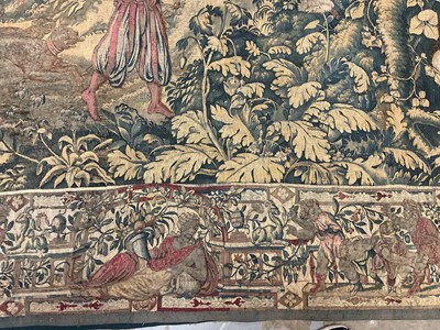 Lot 1722 - A late 16th century Flemish tapestry worked with bear hunting scenes in a mountainous forest