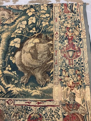 Lot 1722 - A late 16th century Flemish tapestry worked with bear hunting scenes in a mountainous forest