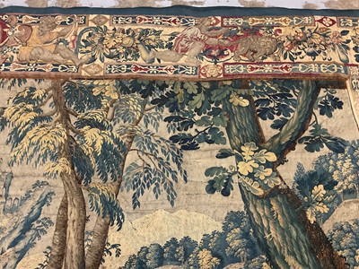 Lot 1722 - A late 16th century Flemish tapestry worked with bear hunting scenes in a mountainous forest