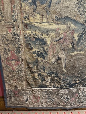 Lot 1722 - A late 16th century Flemish tapestry worked with bear hunting scenes in a mountainous forest
